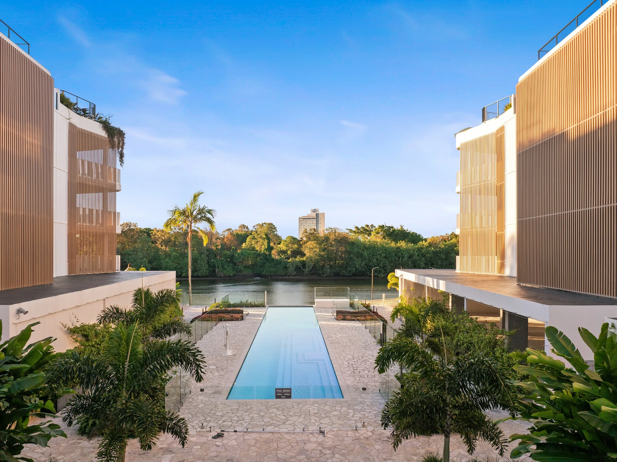 Pool between the two buildings, river beyond