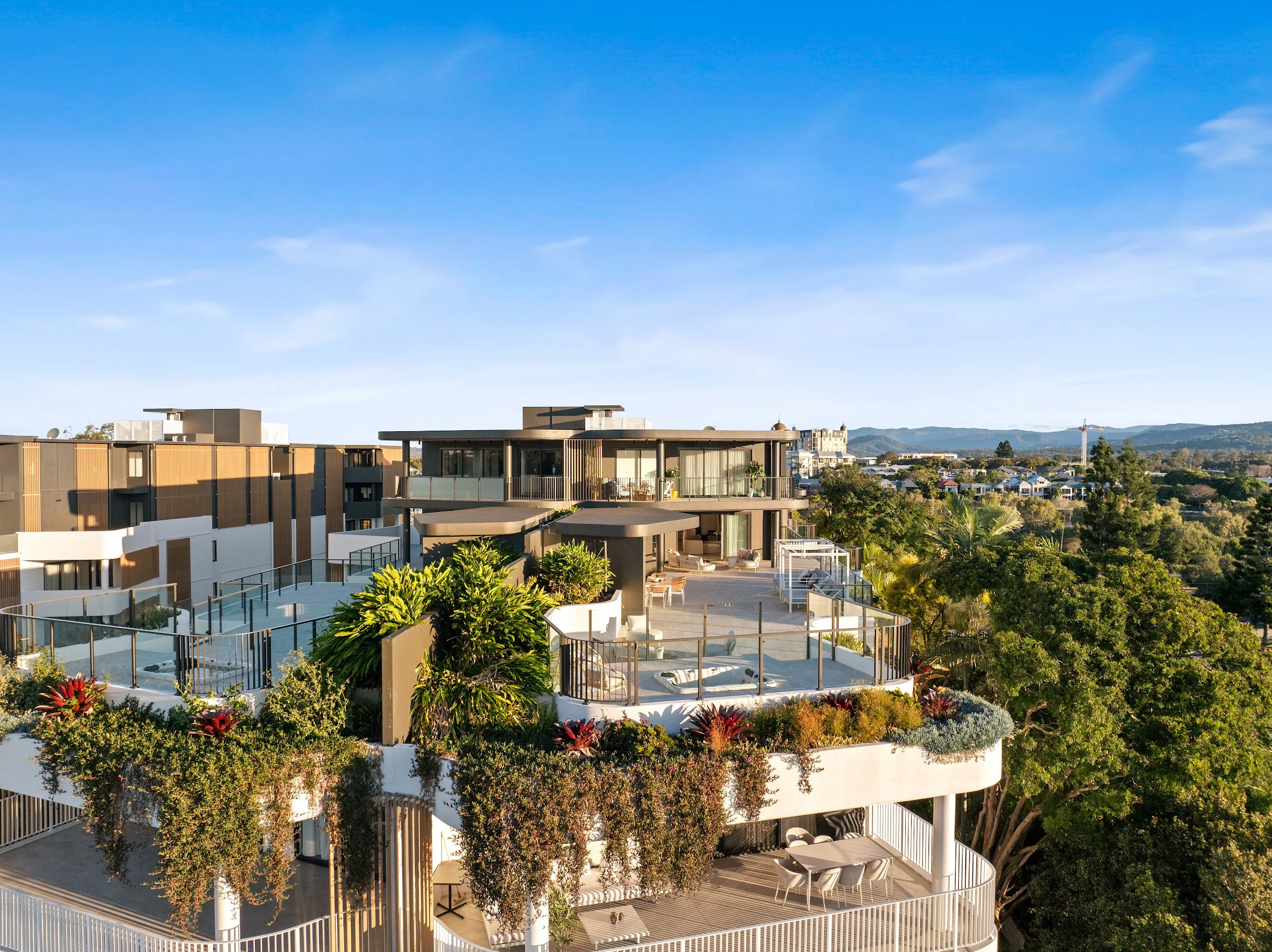 Curved terrace edge with cascading planting, hinterland beyond